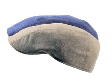 Schiebermütze aus Seiden-Woll-Mix in Natur mit farbiger Garnitur